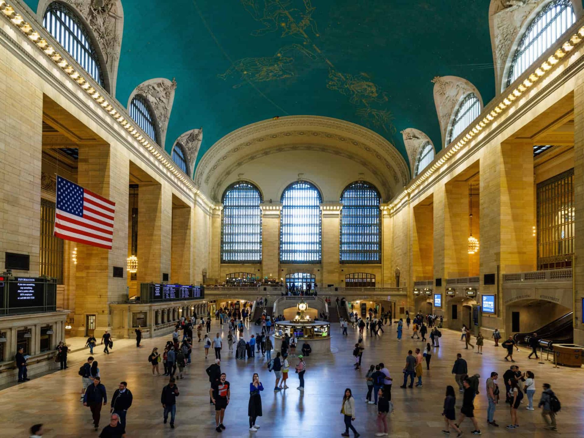 Inside the Grand Central Terminal looking up at the ceiling which depicts the winter sky with constellation figures.